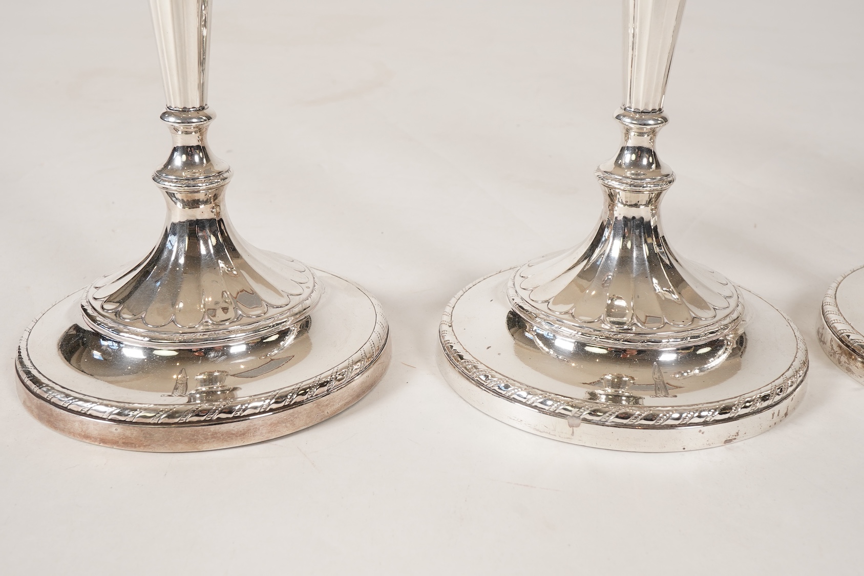 A set of four George III silver candlesticks, by John Green, Roberts, Mosley & Co